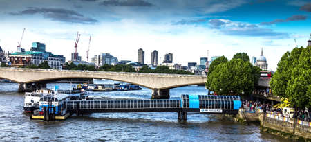 LONDON, UK - JUNE 6, 2015: City of London in late afternoon light from Hungerford Bridge. This view includes: St. Paul`s Cathedral,   The Leadenhall Building (The Cheesegrater), 20 Fenchurch Street (The Walkie-Talkie),Tower 42, and Waterloo Bridge.のeditorial素材