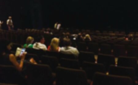 Blured view of spectators during the intermission of the performance in theaterの写真素材
