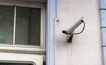 Security Camera near window on great plastered wall