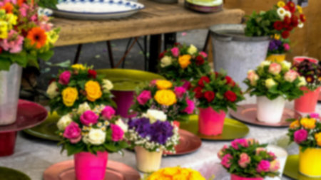 Blurred view of different flowers at shop on open air at small city market.の写真素材
