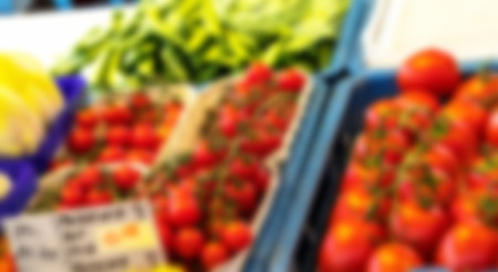 Blurred view of fresh organic tomatos at outdoor market. Salzburg, Austria,の写真素材