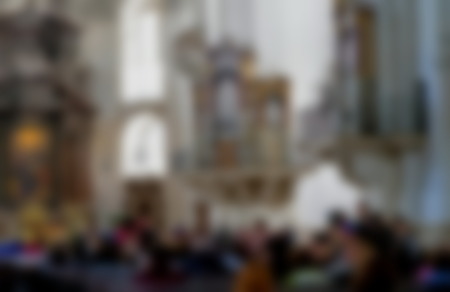 Blurred view of tourist group in catholic churchの写真素材