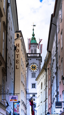 Salzburg, Austria - July 15,2017: View of famous medieval streets of Salzburg, Austria. Currently a lively shopping area. Wolfgang Amadeus Mozart was born. Clock tower of Old Town Hallのeditorial素材