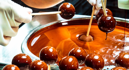 Salzburg, Austria - July 15,2017: Showcase of The Mozartkugeln shop. An old photo showing the details of the production of the famous Austrian sweets "Mozart" in 19th centure.のeditorial素材