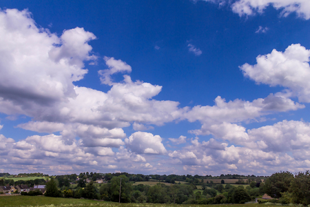 English summer cloudy day landscape along the highway A44の写真素材