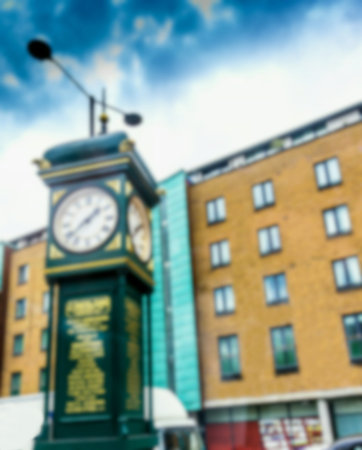 Blurred view of J. Smith and Sons Clock located on a pedestrian island between Goswell Road and City...