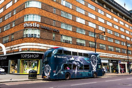 LONDON, UK - JUNE 9, 2015: View of Oxford Street at summer cloudy day. Oxford Street is a major road in the West End of London, UK.のeditorial素材