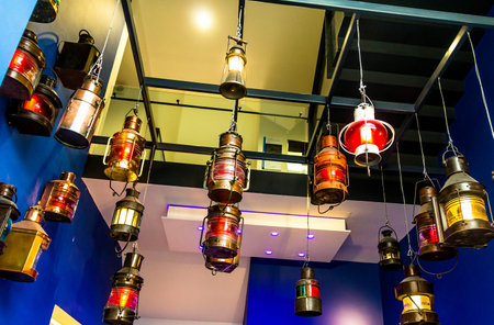 LONDON, UK - June 9, 2015: Old ship lanterns in one of the halls of The National Maritime Museum in...
