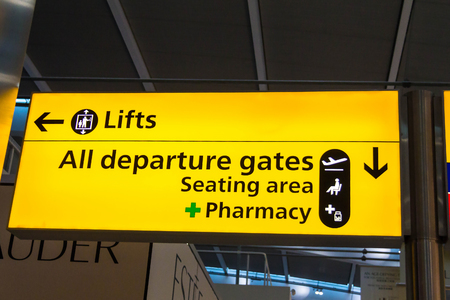 LONDON, UK - June 9, 2015: All departure gates and Pharmacy sign in the Heathrow airport.のeditorial素材