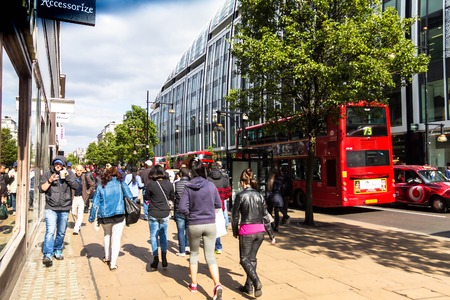 LONDON, UK - JUNE 9, 2015: Tourists and customers near Marble Arch Park house store on Oxford Street in London. Oxford Street has approximately half a million daily visitors and 320 stores.のeditorial素材
