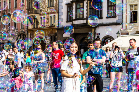 Prague, Czech Republic -July 23,2017: Street performer making bubbles to entertain people at...