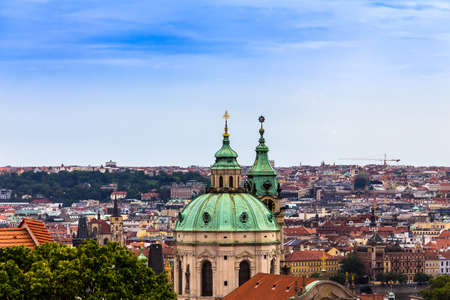 Summer aerial view of the Old Town architecture with red roofs and church of Saint Nicholas in Prague , Czech Republic.のeditorial素材