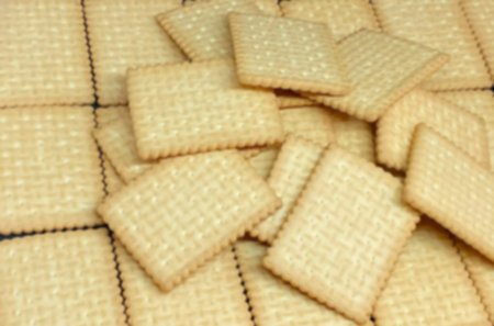 A pile of cookies on the table as a background. Blurred view
