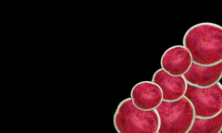 Half of ripe fresh juicy watermelons pile on a black backgroundの写真素材