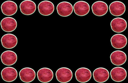 Half of ripe fresh juicy watermelons frame on a black backgroundの写真素材