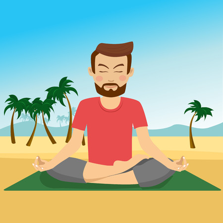 Young man doing yoga on a mat at tropical beachの写真素材