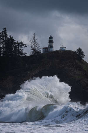 Lighthouse on a stormy day in the Pacific Ocean, Oregonの写真素材