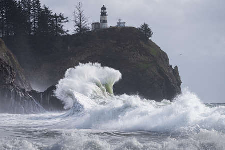 Big wave breaking on the rocks on a stormy day in Oregonの写真素材
