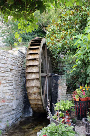 Wheel of an old water millの写真素材