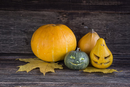 Close-up of halloween pumpkin on bright autumnal leaves