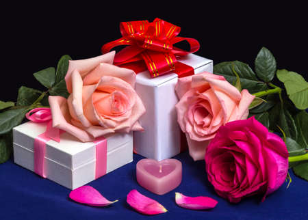 Gift Boxes with Bows, Roses and Candle on a dark Background. For Valentine`s Day, Bithday, Wedding.の写真素材