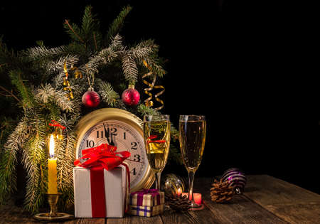 New Years is soon! Candles and gifts under the tree. Dark background.の写真素材