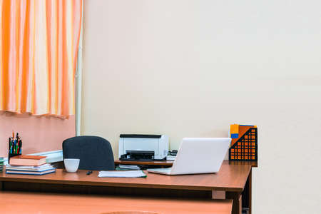 Workplace in office. Table with computer. Nobody.の写真素材