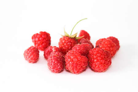 Heap of red ripe raspberry isolated on white background. Close up.の写真素材