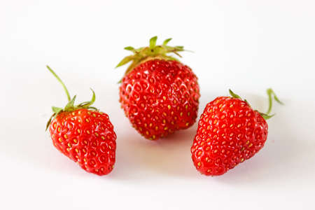 Large red strawberries. Strawberries close-up. Sweet and juicy berries on a white background.の写真素材