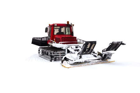 A machine for preparing a ski slope. Ratrak "snow cat" is laying a ski track. Isolated on white background.の写真素材