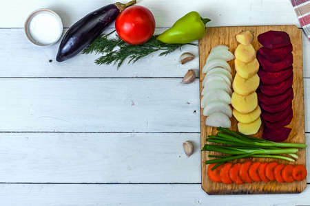 Decorative background of kitchen themes. Cooking. Vegetables on the table. Flat view.の写真素材