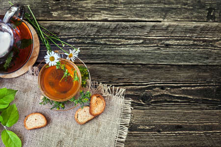Tea with healing daisy. Home recipe. Remedy for cough and cold. Top view.の写真素材