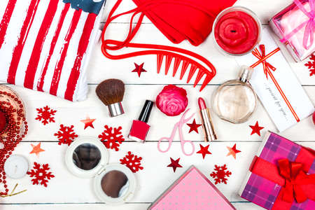 Accessories and cosmetics lie on the table - a view from above. Flat layout on a light background.の写真素材