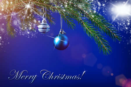 Christmas tree toys on a spruce branch and bright magic lights. The spirit of Christmas!の写真素材