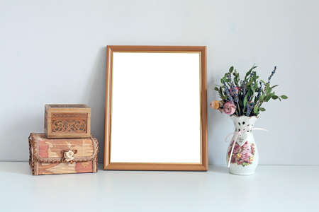 Mockup 8x10 - wooden frame with boxes and flowers. Portrait orientation.の写真素材