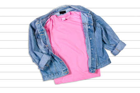 Pink T-shirt and Jeans Jacket on a White Wooden Background - Flat Lay, Ttop Viewの写真素材