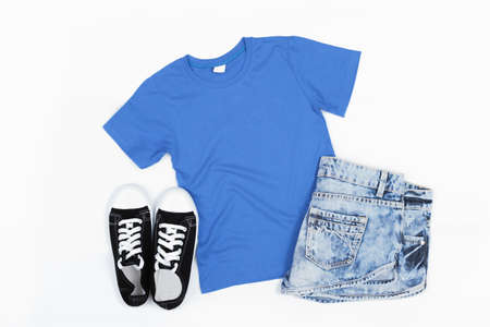 Blue Short Sleeve T-Shirt Mockup on a White Wooden Background - Flat Lay, Top Viewの写真素材