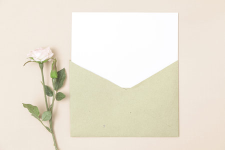 Wedding invitation or greeting card mockup. Blank white card 5x7 and craft paper envelope.