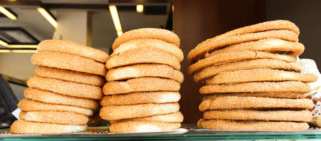 fresh bakery. Crispy fragrant buns with sesame seeds on the bakery shelf.の写真素材