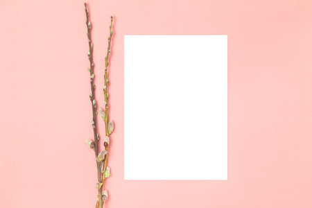 Wedding invitation or greeting card mockup. Blank white card 5x7 with tree branches on a pink...