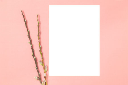 Wedding invitation or greeting card mockup. Blank white card 5x7 with tree branches on a pink...