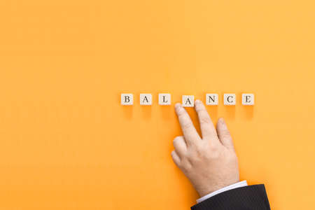 The inscription Balance made from cubes. Conceptual image for an article or review.の写真素材