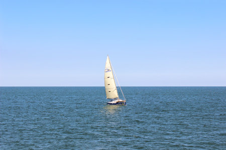 VARNA, BULGARIA â JULY 09, 2016. Sailing yacht on the background of the blue sea. Beautiful view of the sea bay.のeditorial素材