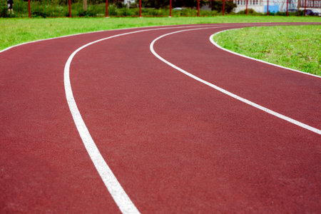 Running track at the stadium. Conceptual photo about doing sports.
