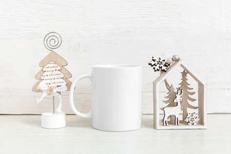 Mockup of a white ceramic mug with winter symbols. winter mockup.の写真素材