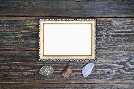 Bronze vintage frame on the background of dark rough boards. Mockup to show artwork.