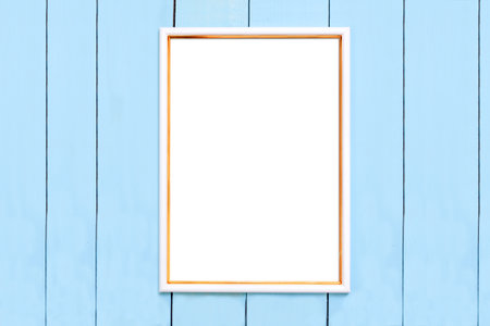 Vertical white and gold frame on a blue wood background. frame mockup for your design.の写真素材