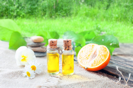 Orange oil - essential oil in a glass jar - traditional oriental medicineの写真素材