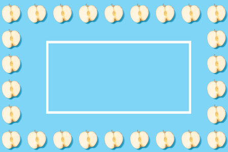 Creative background with apples and white paper frame - summer minimal concept