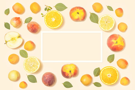 Creative summer mockup with bright tropical fruits and frame on pink backgroundの写真素材